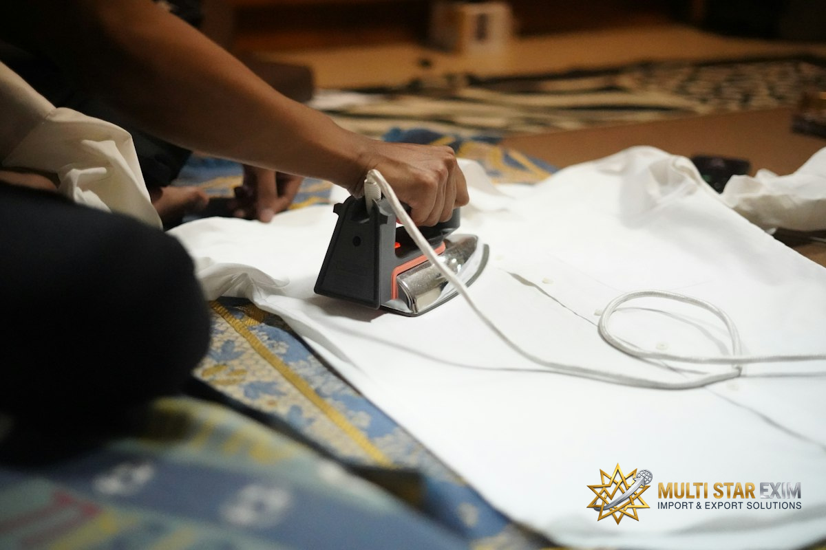 Ironing a white shirt with a black iron